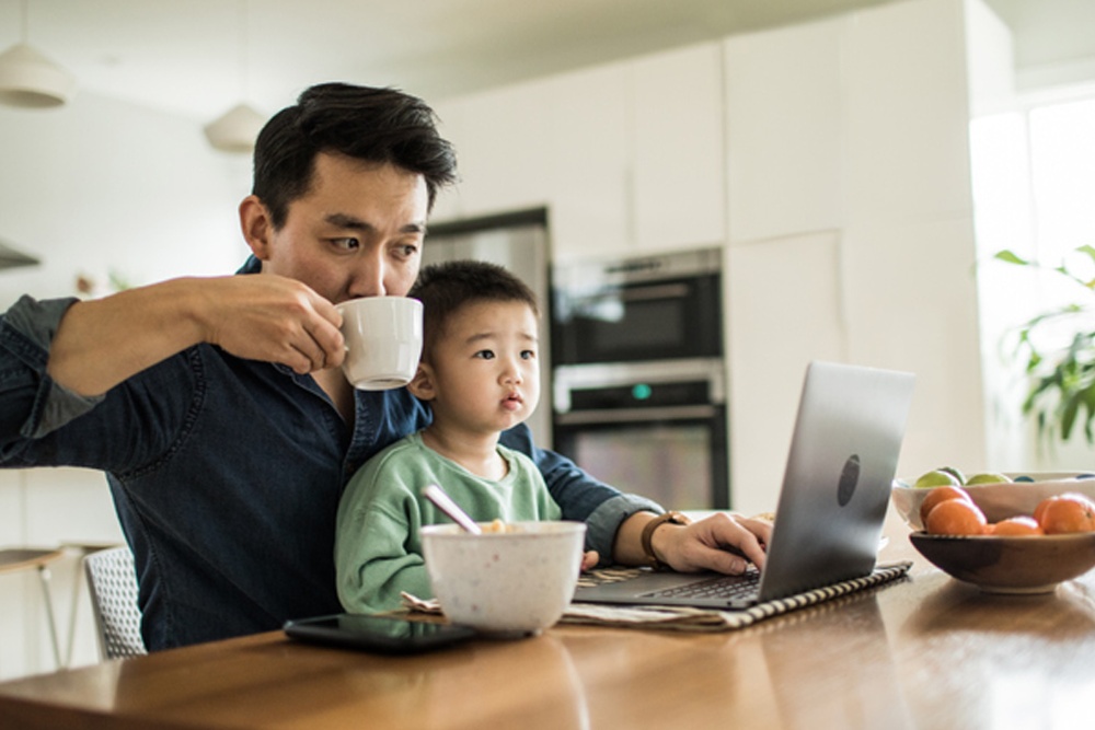 Man looking at online Ford account on a laptop